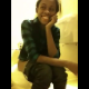 A black girl is video recorded as she has trouble taking a shit in a public restroom. She is camera shy, and so is her turd. No audible pooping sounds.